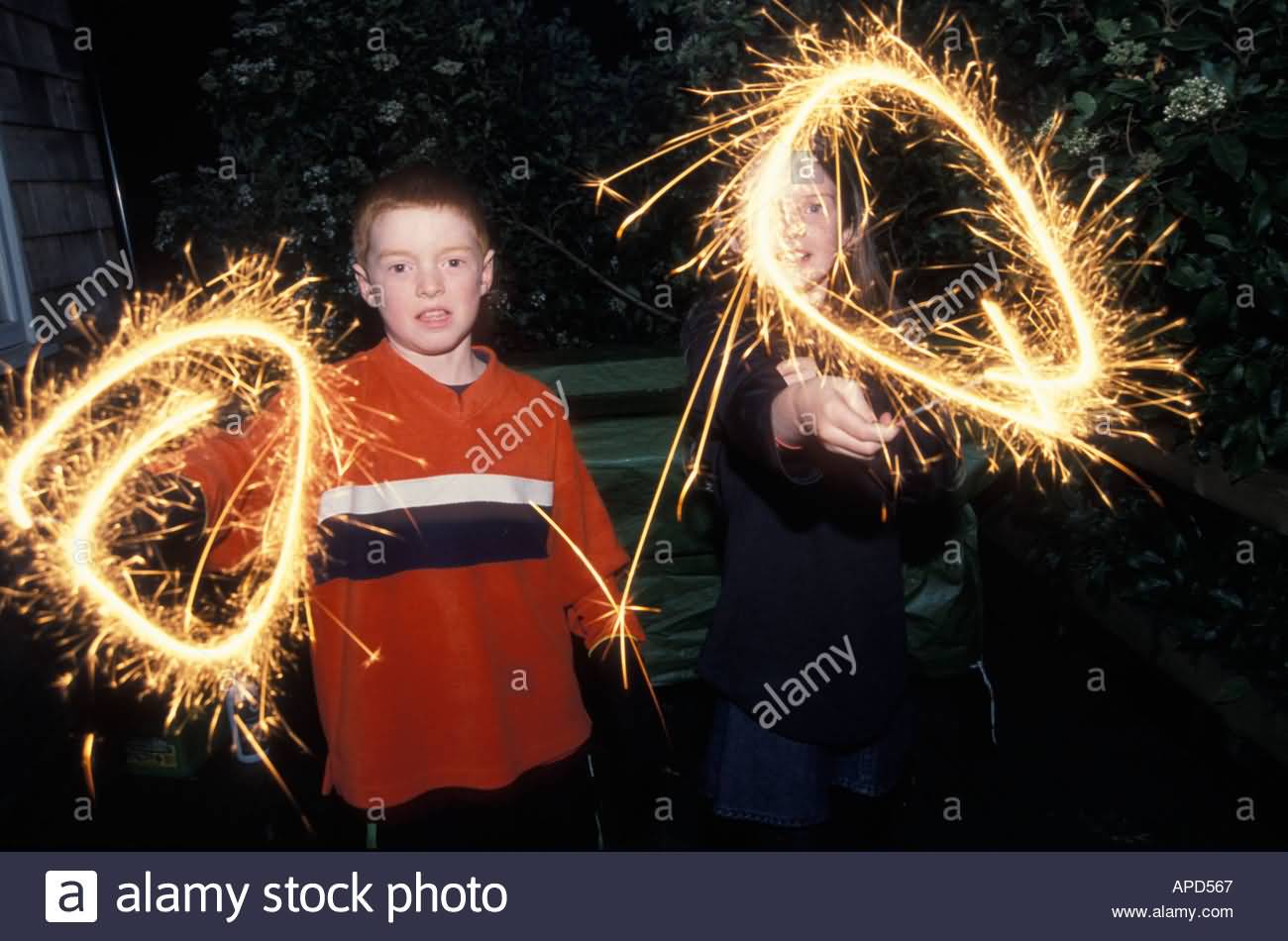 Children Waving Sparkles On Guy Fawkes Night Parade