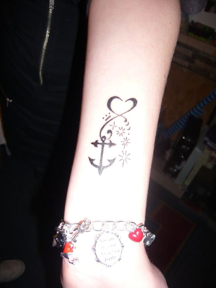 Classic Black Ink Anchor Tattoo On Girl Left Wrist