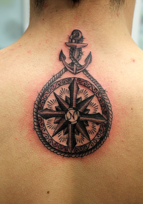 Classic Black Ink Anchor With Compass Tattoo On Man Upper Back