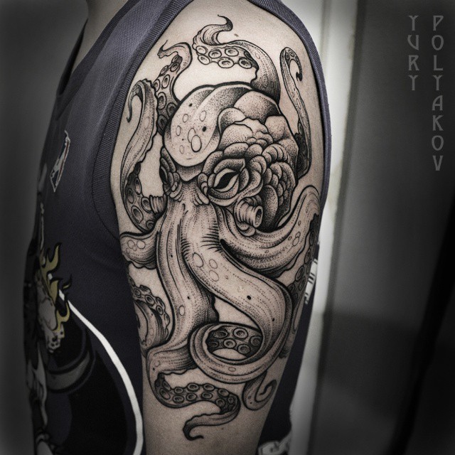 Classic Black Ink Octopus Tattoo On Man Left Shoulder