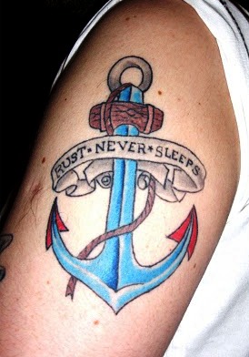 Colorful Anchor With Rust Never Sleeps Banner Tattoo On Right Shoulder
