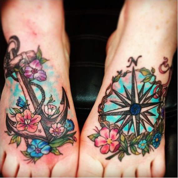 Colorful Traditional Anchor And Compass With Flowers Tattoo On Feet