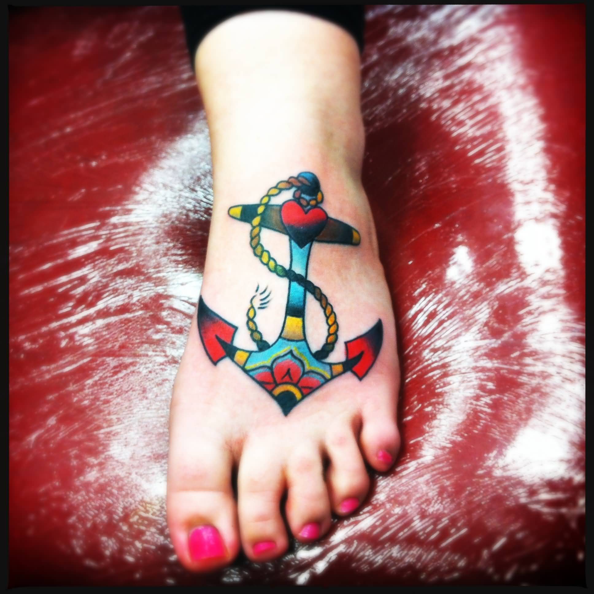Colorful Traditional Anchor Tattoo On Girl Left Foot
