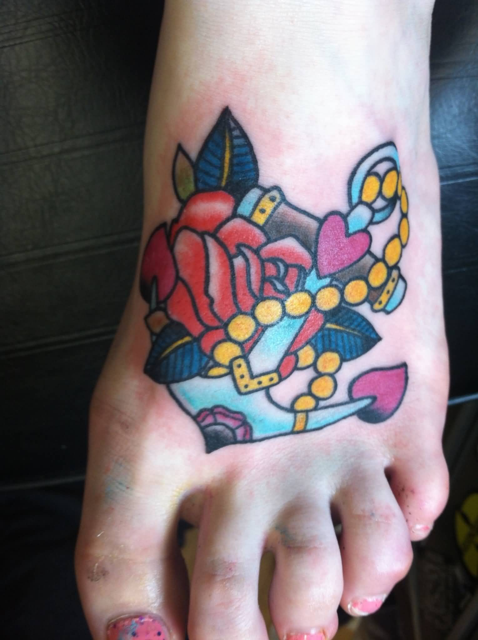 Colorful Traditional Anchor With Rose Tattoo On Girl Left Foot