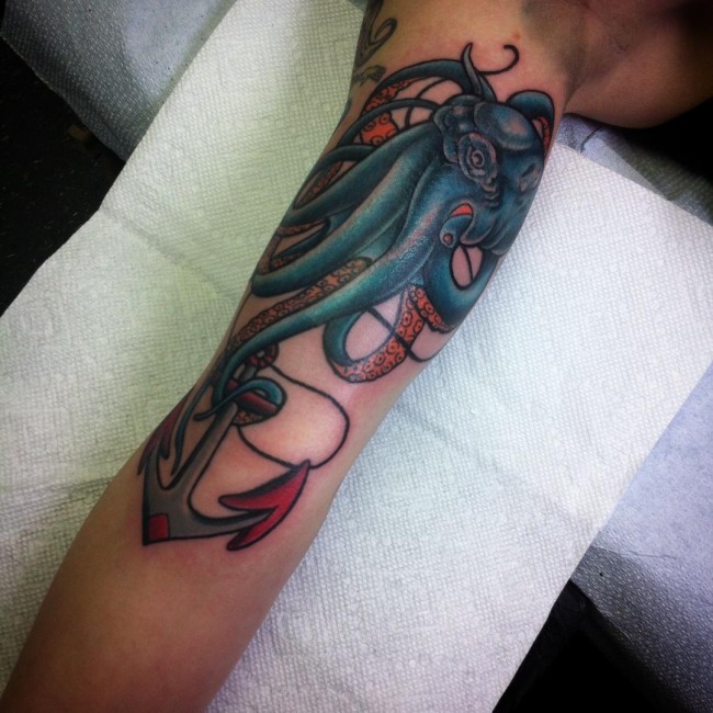 Colorful Traditional Octopus With Anchor Tattoo On Bicep