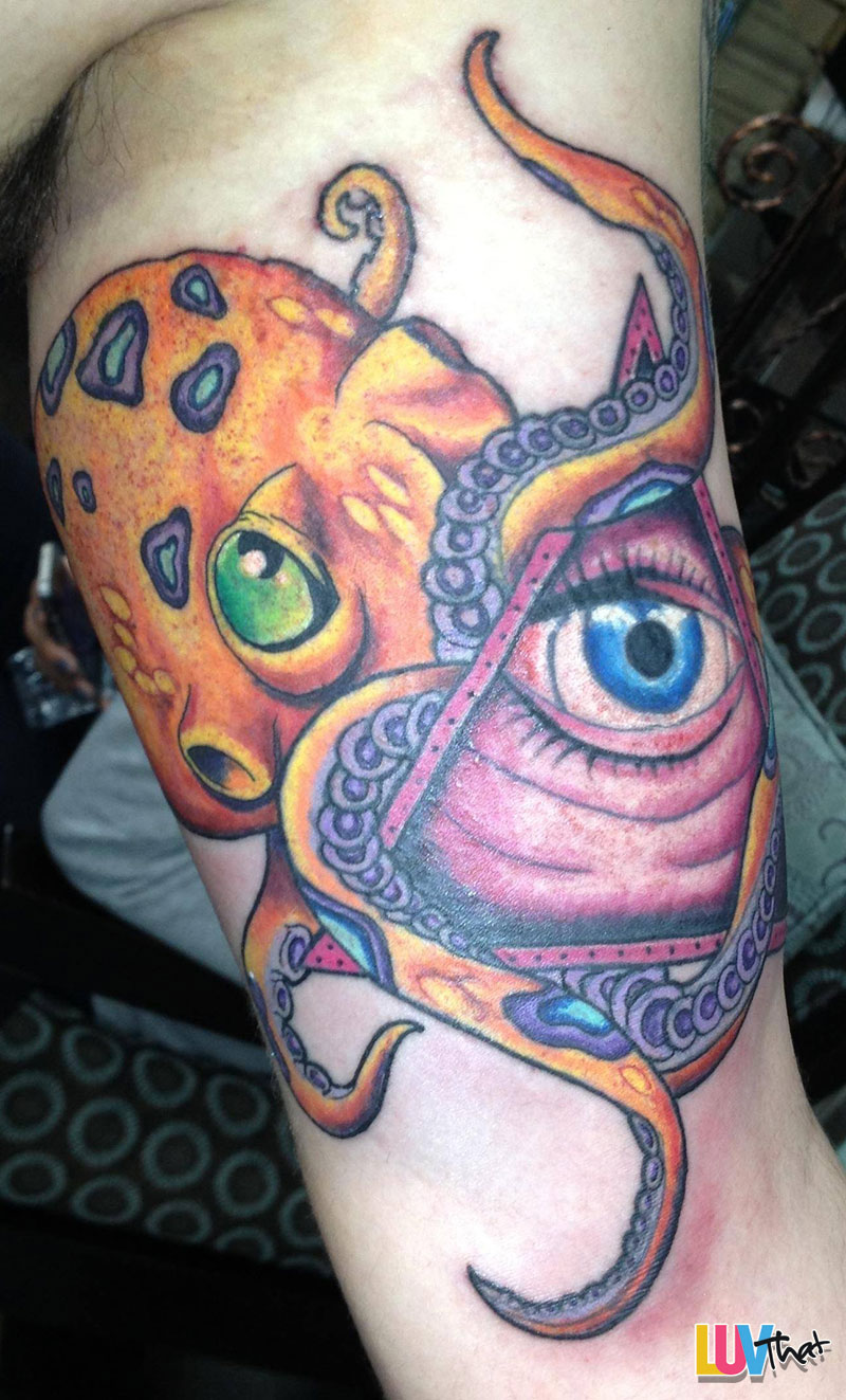 Colorful Traditional Octopus With Illuminati Eye Tattoo On Left Bicep