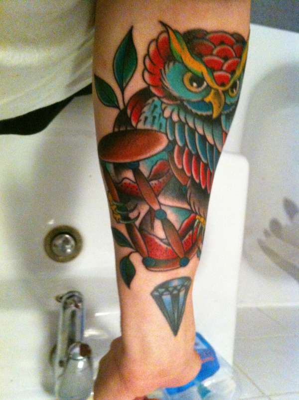 Colorful Traditional Owl With Hourglass Tattoo On Forearm