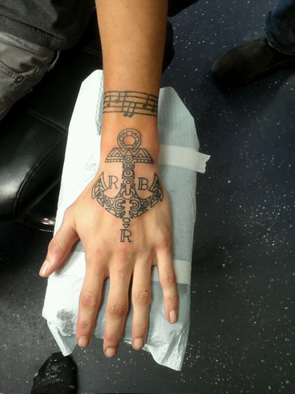 Cool Black Outline Tribal Anchor Tattoo On Left Hand