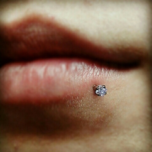 Cool Lower Lip Piercing With Dermal Anchor