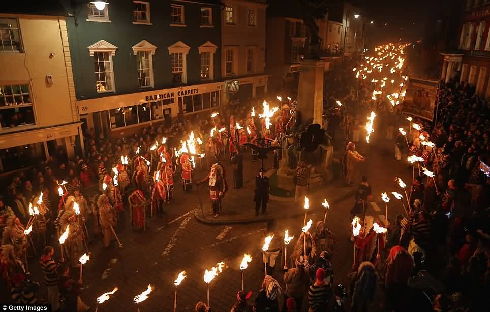 Crowd Gathered Around The Lewes War Memorial To Light Crosses During Guy Fawkes Night Parade