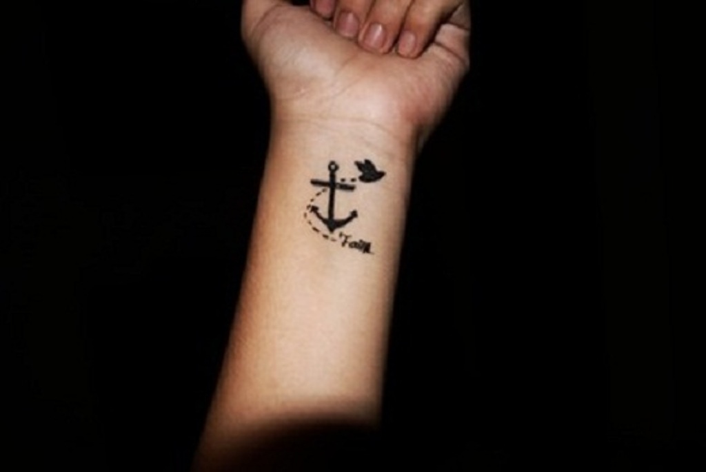 Cute Black Anchor With Flying Bird Tattoo On Left Wrist