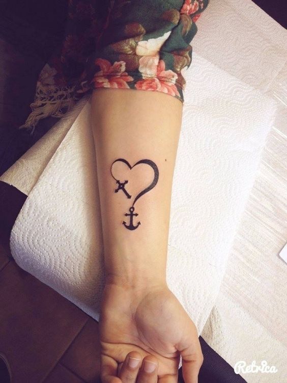 Cute Black Heart With Anchor And Cross Tattoo On Left Forearm