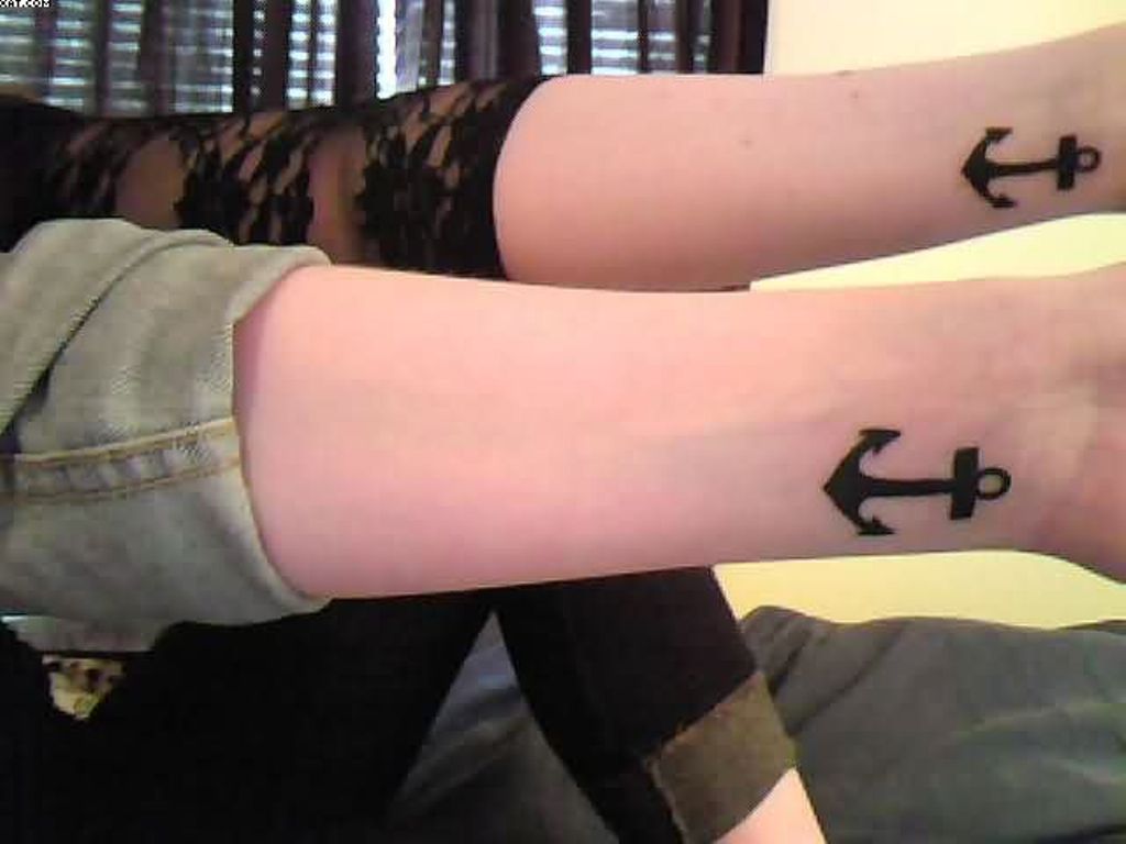 Cute Black Ink Anchor Tattoo On Couple Wrist
