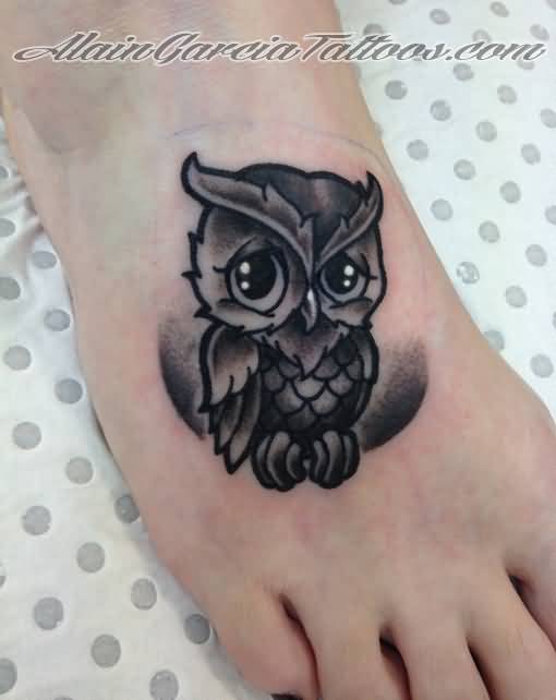 Cute Black Ink Owl Tattoo On Girl Right Foot By Alain M. Garcia