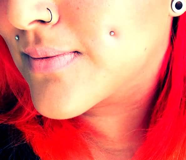 Cute Left Nostril And Cheek Piercing With Silver Studs