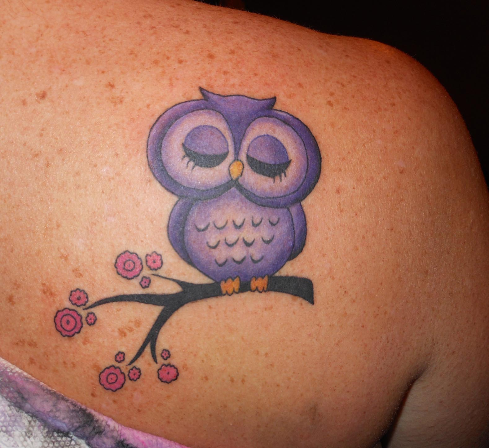 Cute Purple Ink Owl Tattoo On Female Right Back Shoulder