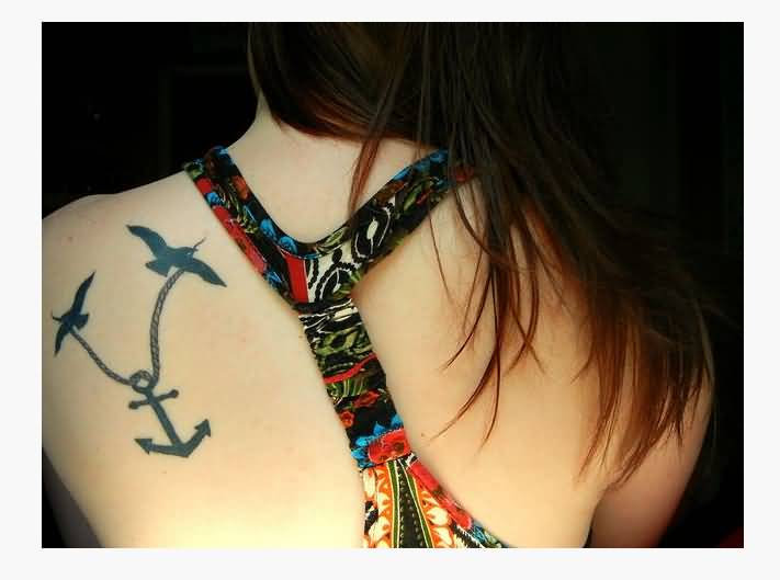 Cute Two Flying Birds With Anchor Tattoo On Girl Left Back Shoulder