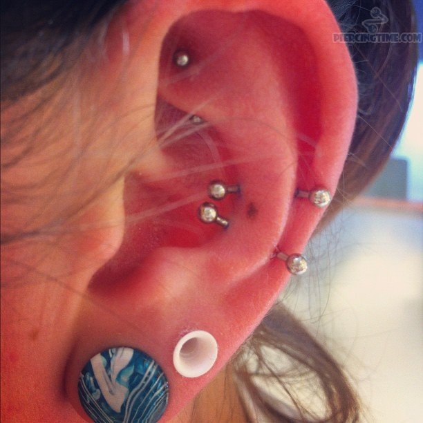 Double Lobe Piercing And Snug And Rook Piercing