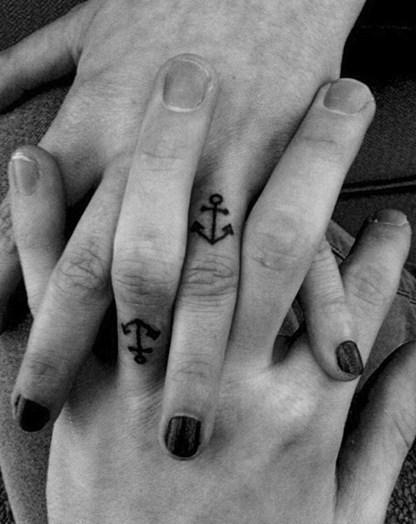 Fantastic Black Ink Anchor Tattoo On Couple Finger