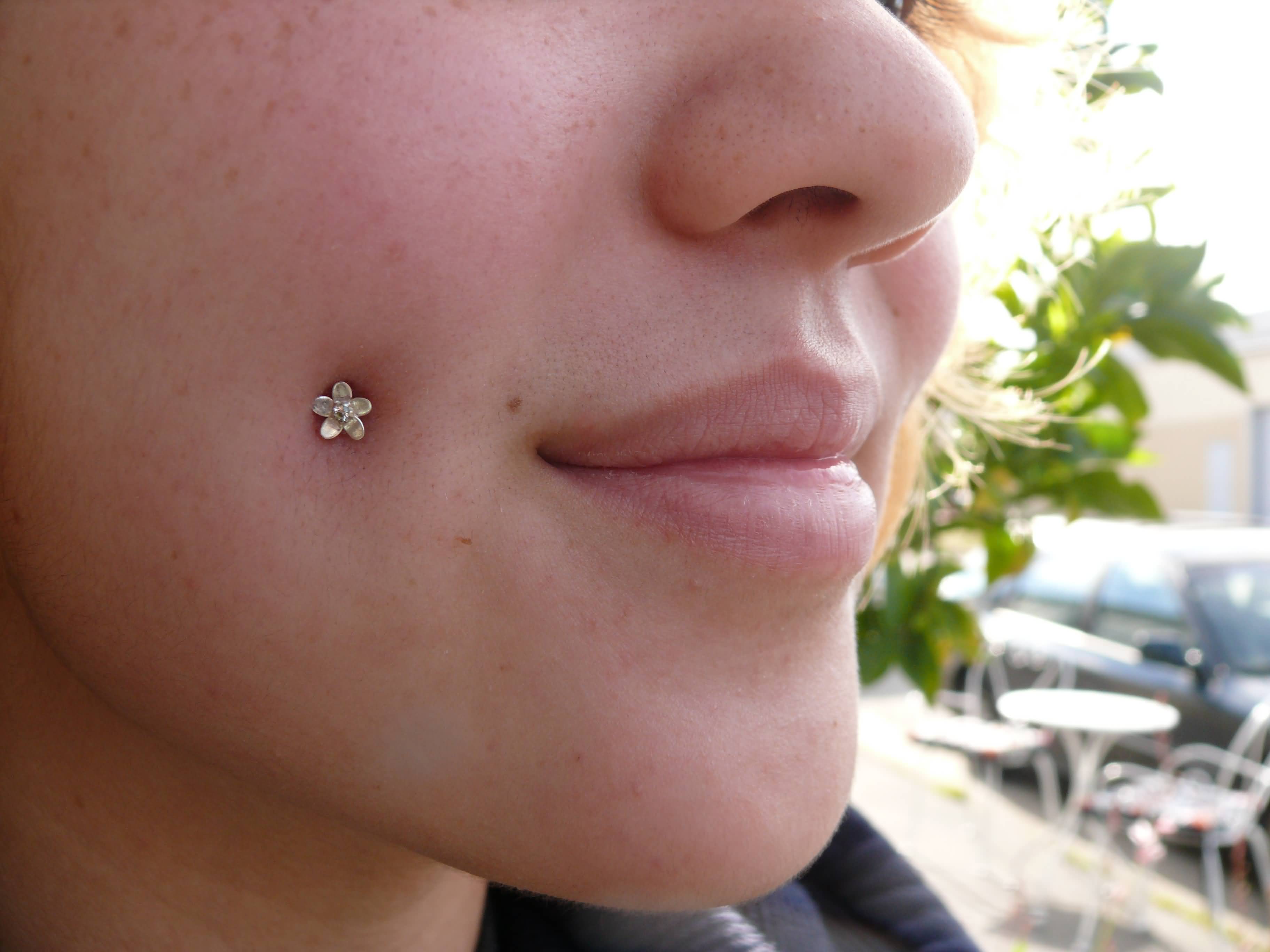 Flower Stud Cheek Piercing For Young Girls