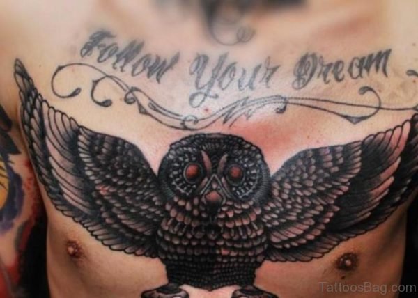 Follow Your Dream - Black Ink Flying Owl Tattoo On Man Chest