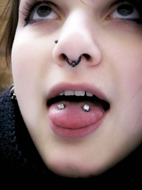 Girl With Black Bead Ring Septum And Venom Piercing