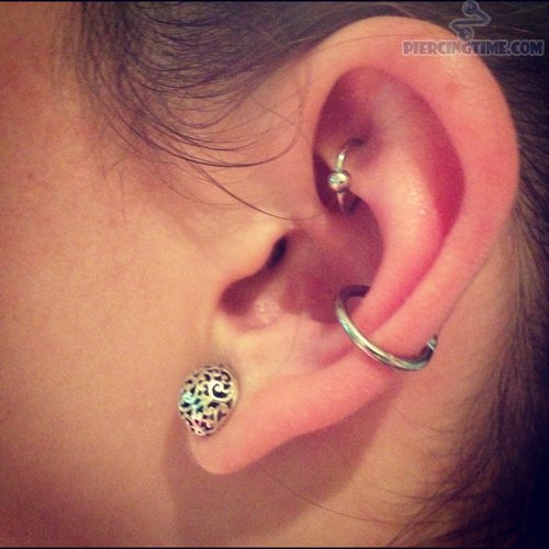 Girl With Lobe Piercing, Conch And Rook Piercing