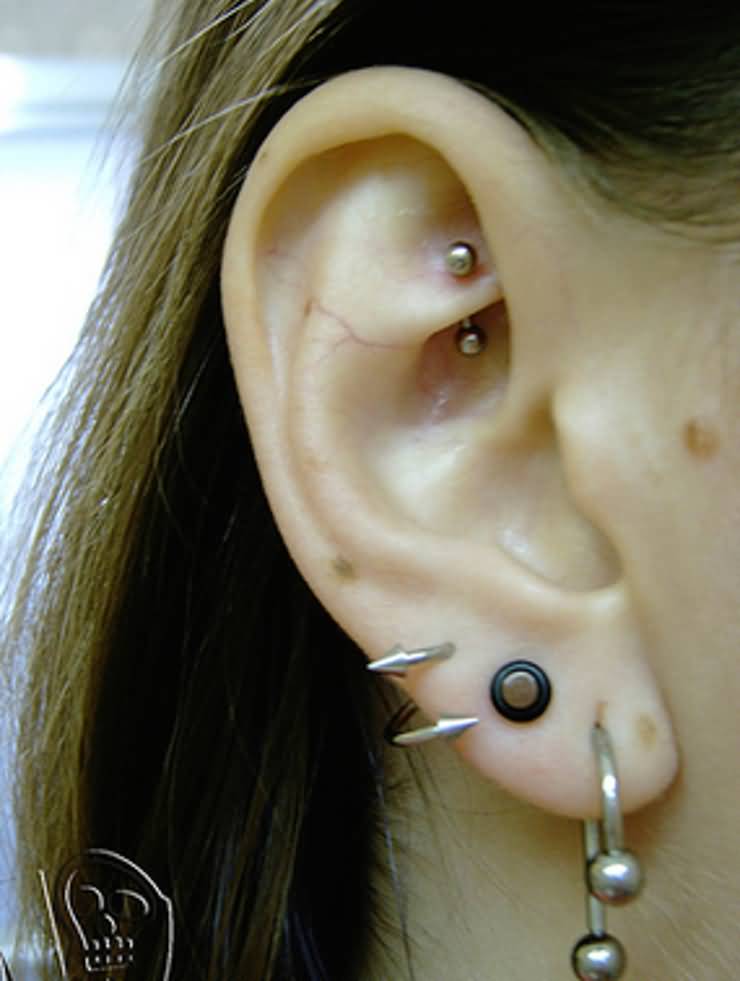 Girl With Right Ear Lobe And Rook Piercing