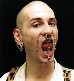Guy With Multiple Ear And Body Piercing