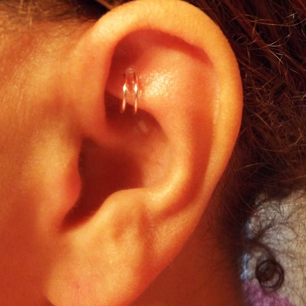 Hoop Ring Rook Piercing On Girl Left Ear