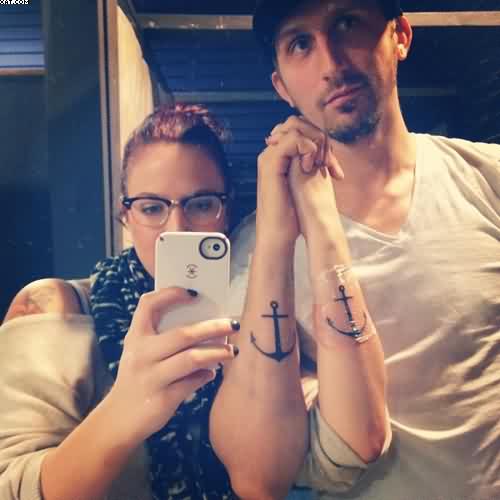 Impressive Black Anchor Tattoo On Couple Arm
