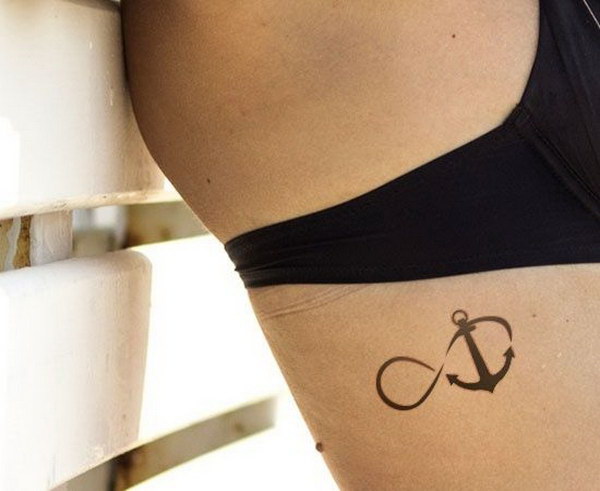 Infinity With Anchor Tattoo On Girl Right Side Rib