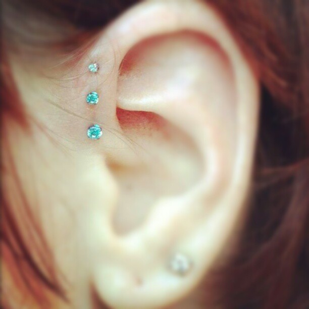 Inner Pinna Piercing With Blue Anchors