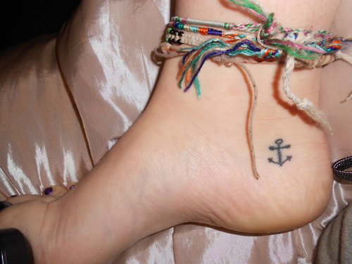 Latest Black Anchor Tattoo On Girl Right Heel