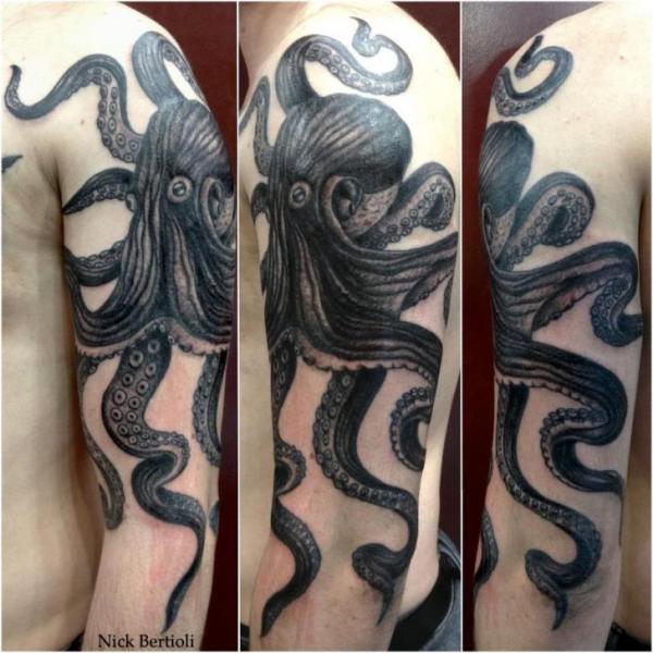 Latest Black Ink Octopus Tattoo On Man Left Shoulder