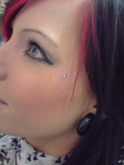 Left Ear Lobe And Butterfly Kiss Piercing With Dermal Anchor