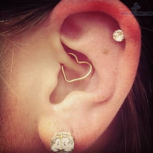 Left Ear Lobe And Rook Heart Piercing Image