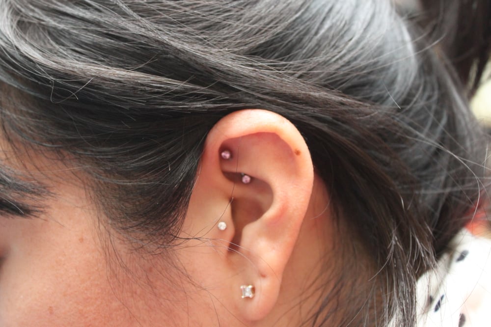 Left Ear Lobe, Tragus And Rook Piercing