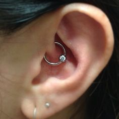 Left Ear Lobes And Daith Piercing With Bead Ring