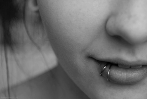 Lip Piercing With Silver Hoop Rings