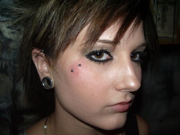 Lobe Stretching And Butterfly Kiss Piercing