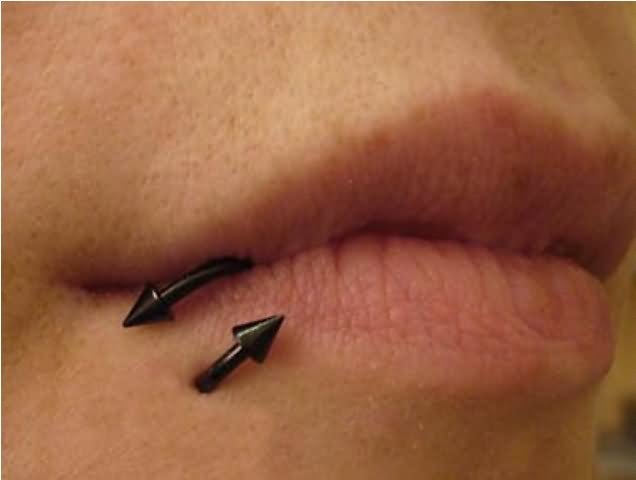 Lower Lip Piercing With Black Spike Barbell