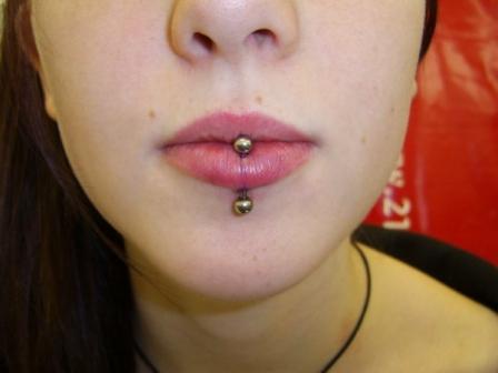 Lower Lip Piercing With Gold Barbell