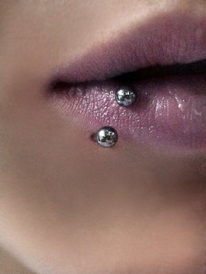 Lower Lip Piercing With Silver Circular Barbell