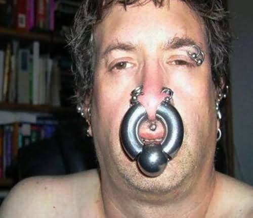 Multiple Face And Extreme Septum Body Piercing