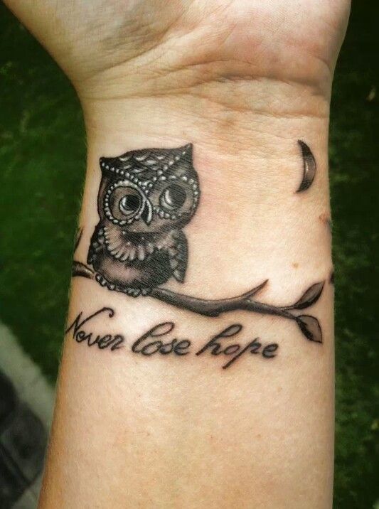 Never Lose Hope - Black Ink Owl On Branch Tattoo On Female Left Wrist