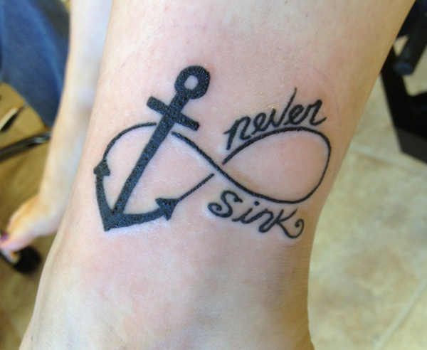 Never Sink - Black Infinity With Anchor Tattoo Design For Leg