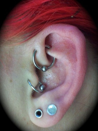 Nice Double Lobe, Tragus And Daith And Rook Piercing