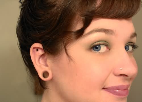 Nose And Right Ear Lobe Dermal Punch Piercing