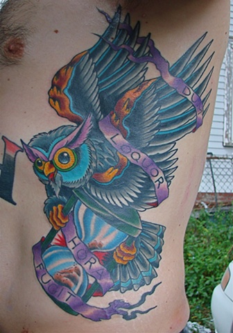 Owl With Hourglass And Banner Tattoo On Man Left Side Rib
